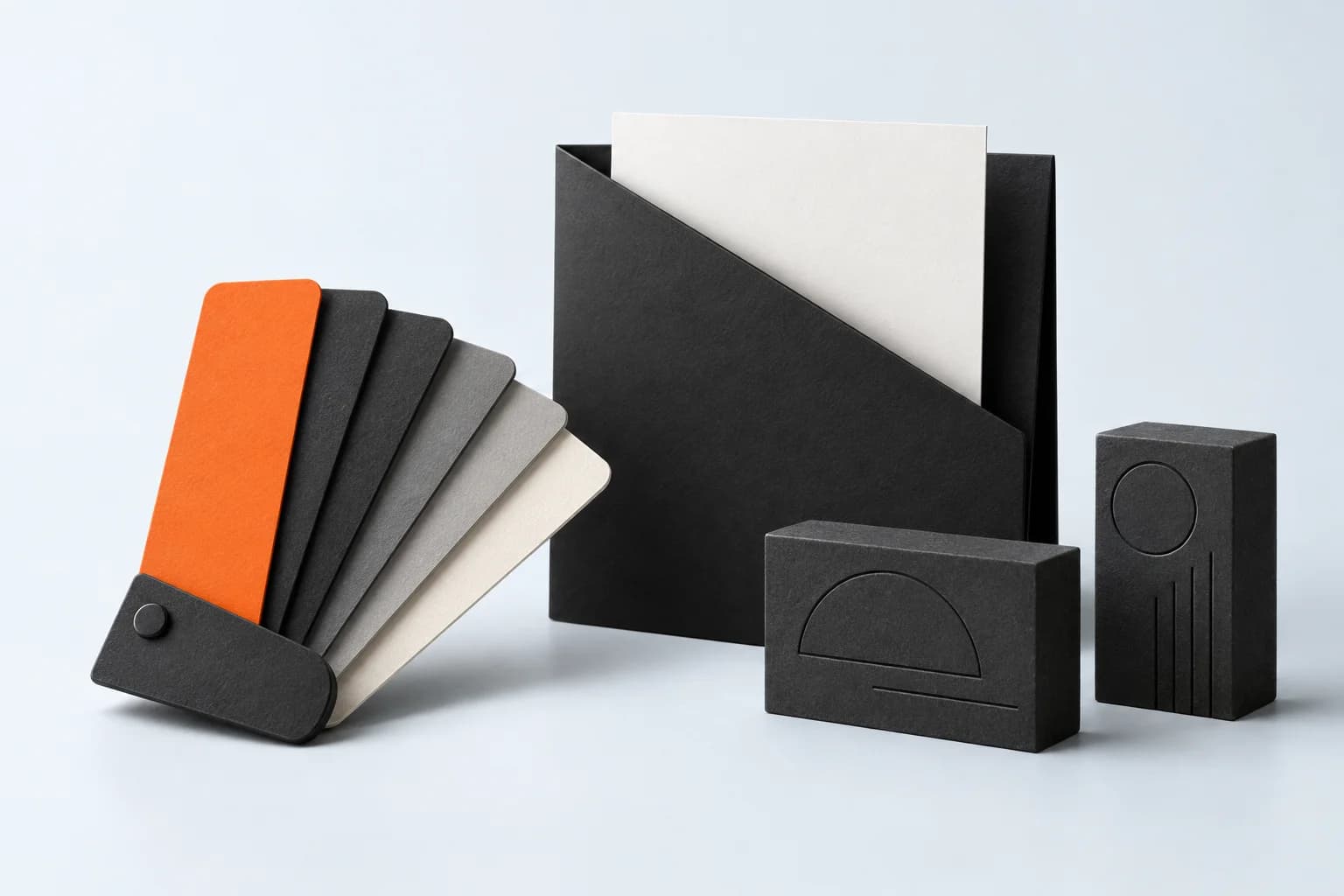 A charcoal brand folder and color swatches with an orange accent swatch.